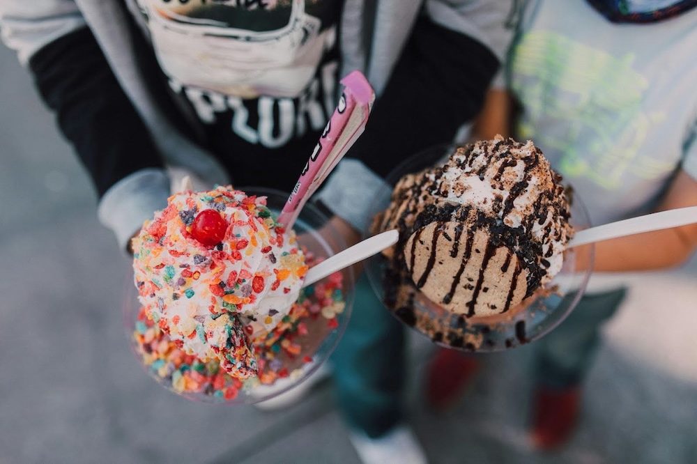 Kids holding cups of ice cream